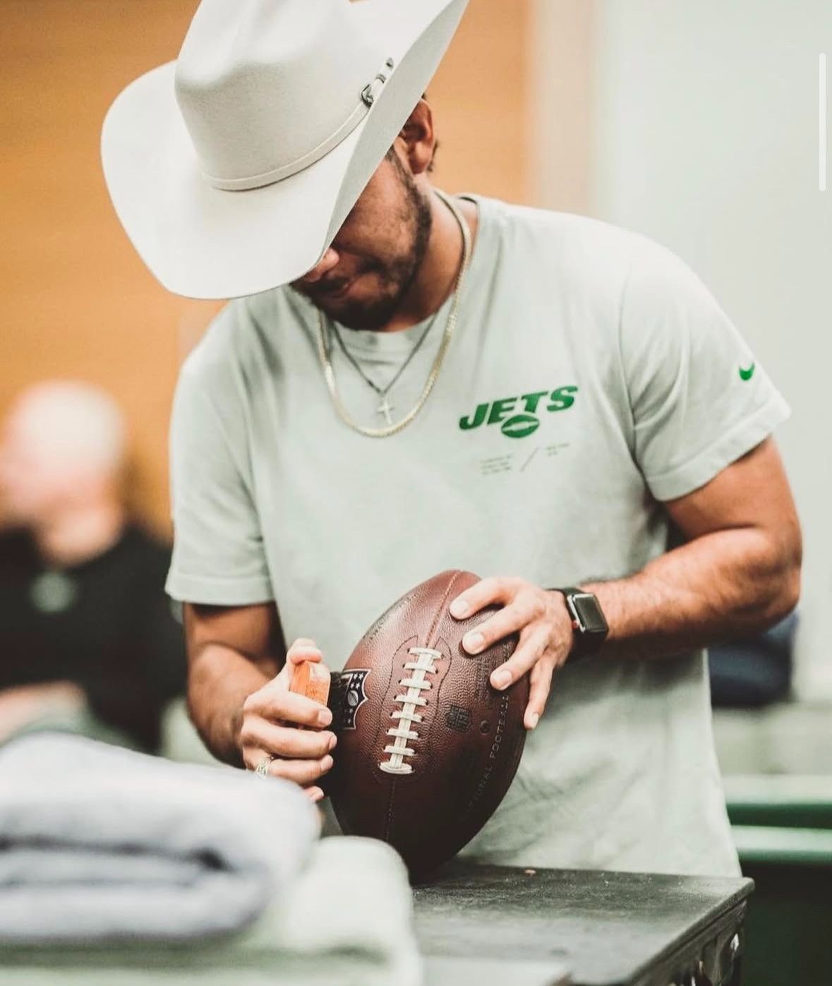 Esteban Zuniga prepping a football