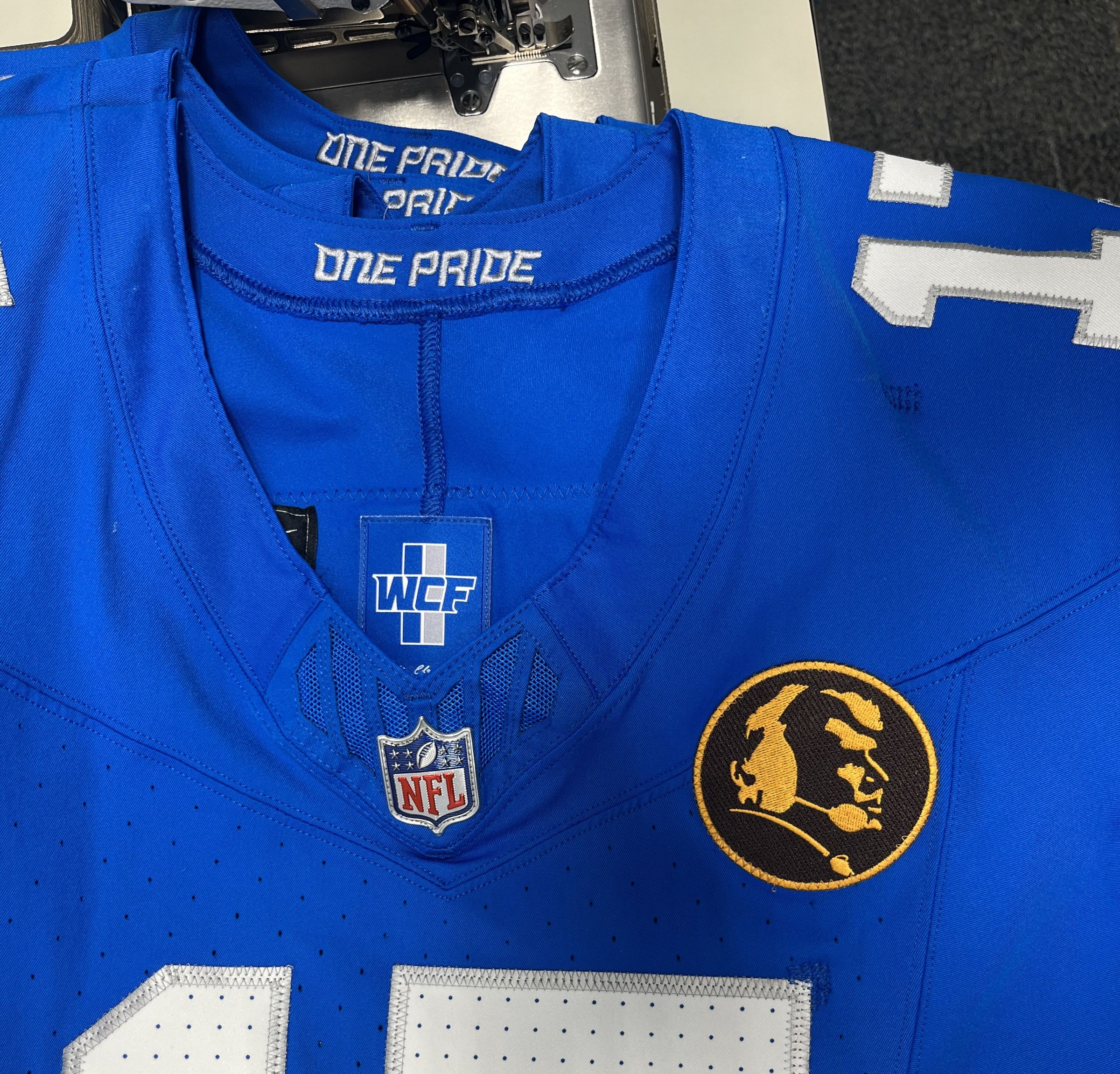 Madden Patch being sewn on Lions jersey for Thanksgiving