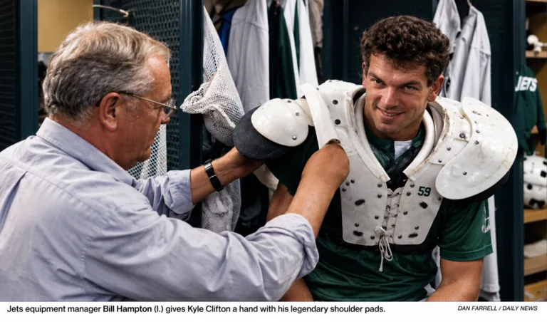 Bill Hampton Works on Kyle Clifton's Shoulder Pads